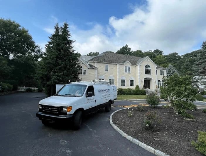 Barberton Power Washing technician performing thorough gutter cleaning service in Barberton