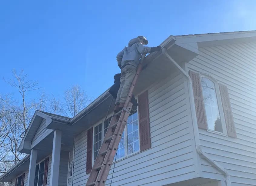 Gutter cleaning and maintenance being performed by Barberton Power Washing in Barberton