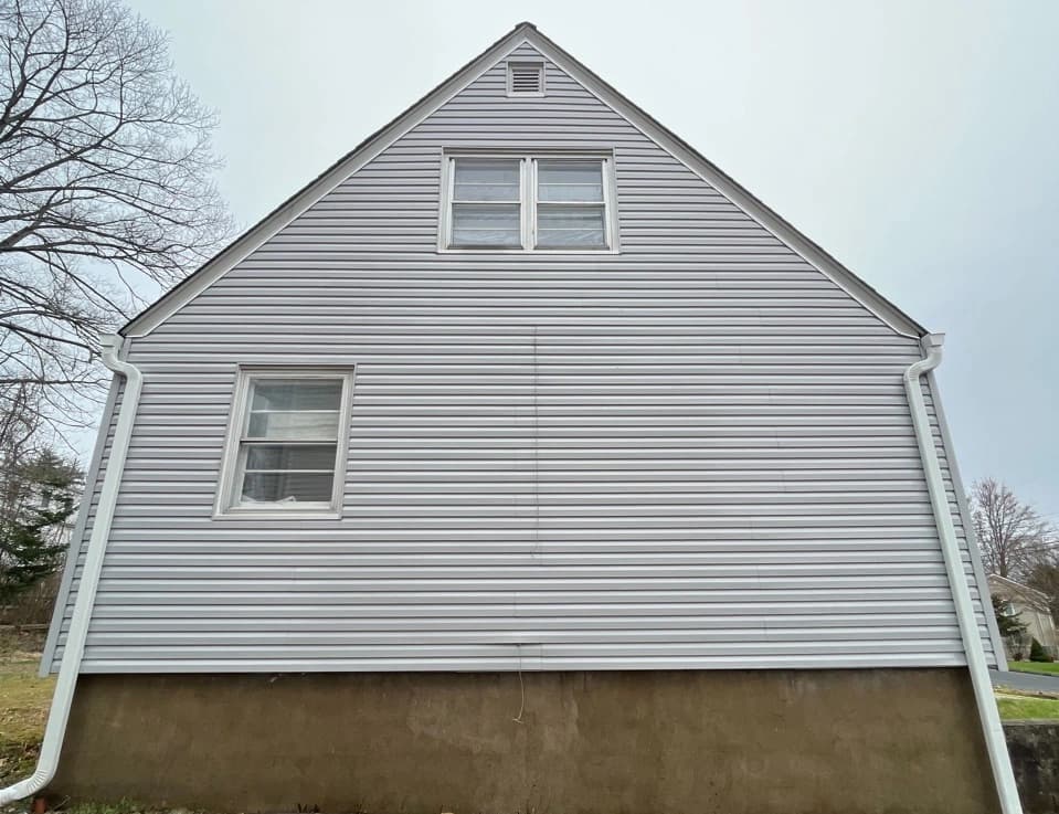 Barberton Power Washing technician performing detailed house washing in Barberton residential area